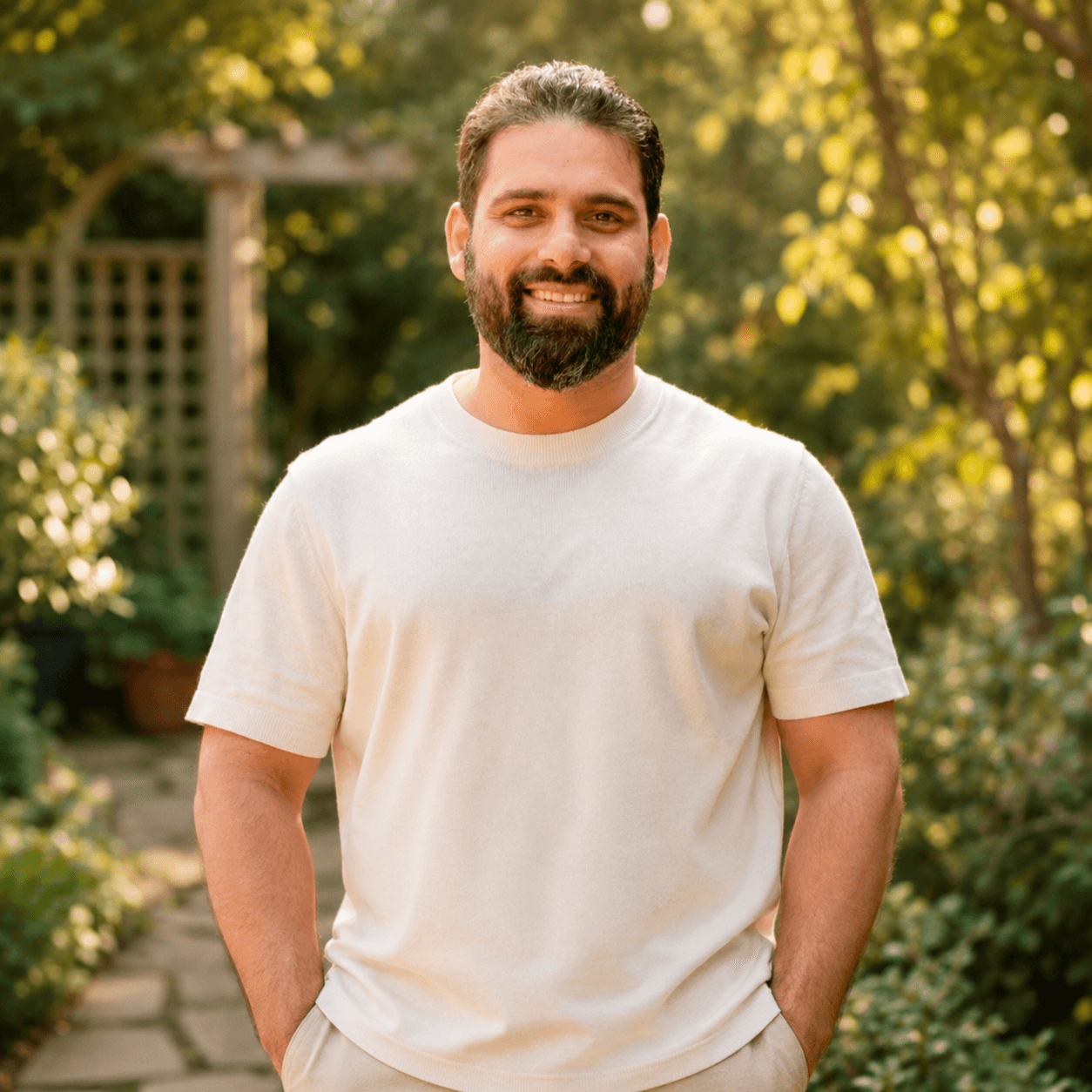 Shashank Lalwani smiling outdoors in a white t-shirt